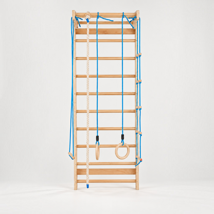 modplay Montessori wooden indoor climbing gym with ladder, rope, rings, and trapeze for active play
