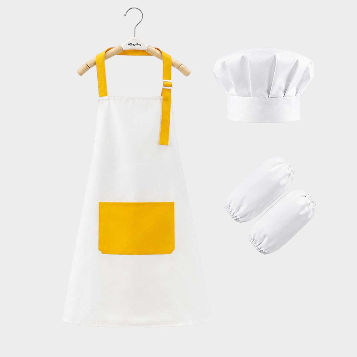 modplay My First Little Chef bundle featuring a white and yellow kids apron, chef hat, and matching arm sleeves.