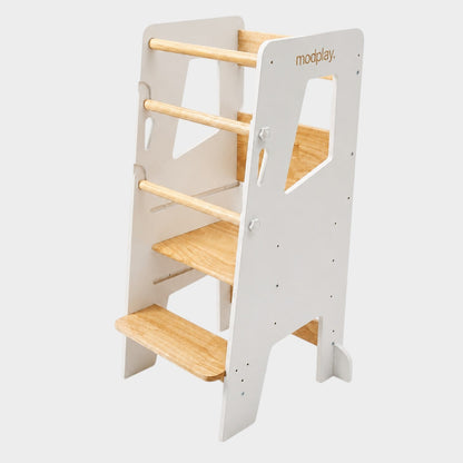 modplay Montessori learning tower in white and natural pinewood with three adjustable height levels for toddlers